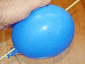 balloon stick experiment